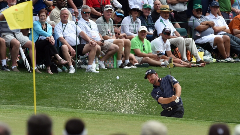 Graeme McDowell chips onto the 15th green during practice at Augusta