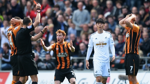 David Meyler is shown the red card for a nasty challenge on Kyle Naughton