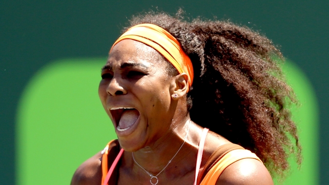 Serena Williams celebrates a point against Svetlana Kuznetsova of Russia during day 8 of the Miami Open