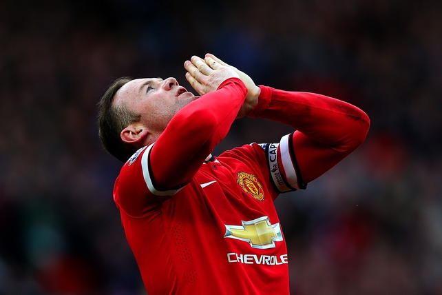 Wayne Rooney of Manchester United celebrates after scoring his team's second goal during the Barclays Premier League match between Manchester United and Aston Villa at Old Trafford