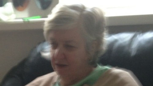 Annette is 5'6" in height, of large build and has silver hair