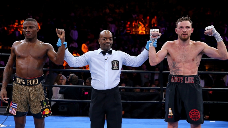 Peter Quillin and Andy Lee stand with the referee as it is declared a draw