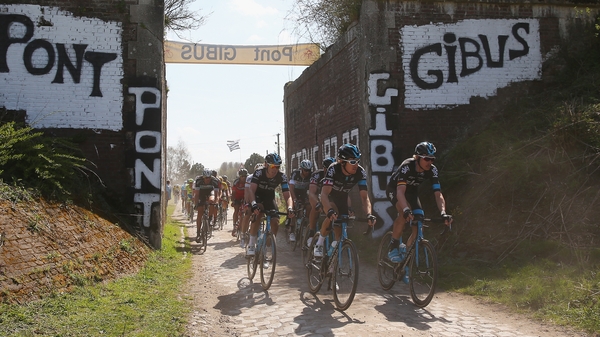 Riders in the Paris-Roubaix race narrowly avoided a train