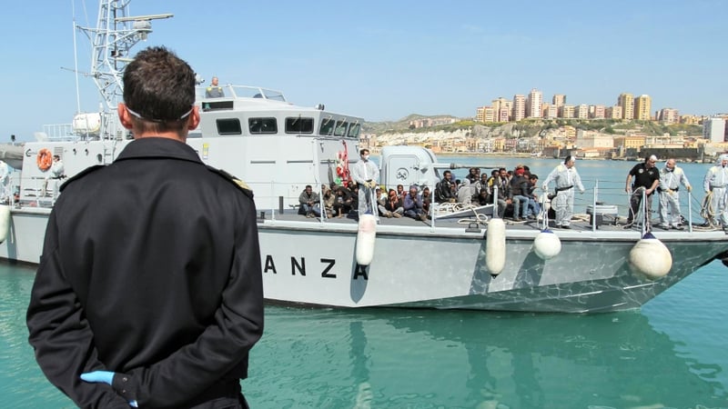Rescued migrants disembark from an Italian vessel in Porto Empedocle, Sicily island, southern Italy yesterday