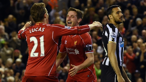 Joe Allen celebrates with Lucas Leiva after scoring Liverpool's second goal
