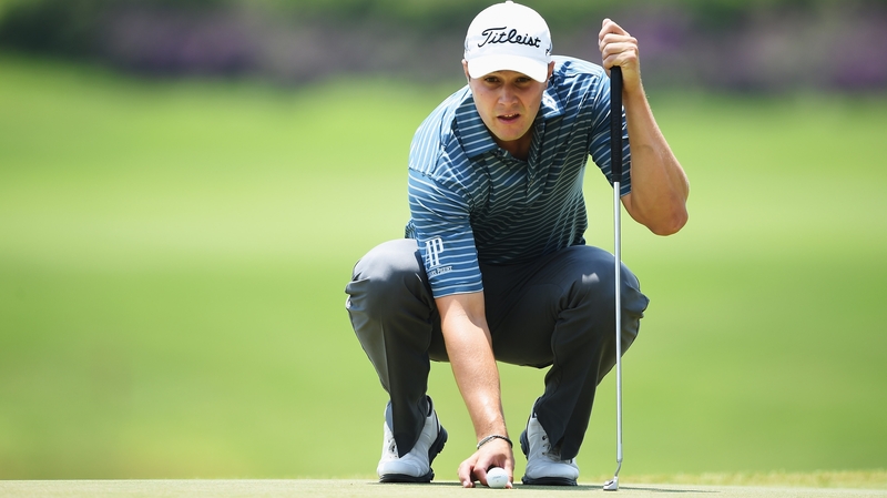 Peter Uihlein sizes up a putt during his second round of 68