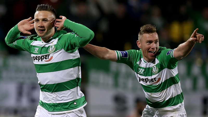 Mikey Drennan cups his hands to his ears after his equaliser