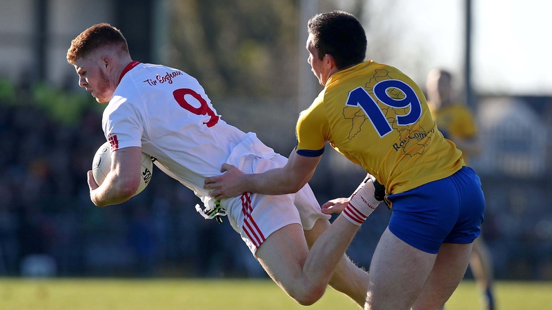 Cathal McShane of Tyrone gets out ahead of Roscommon's Evan McGrath
