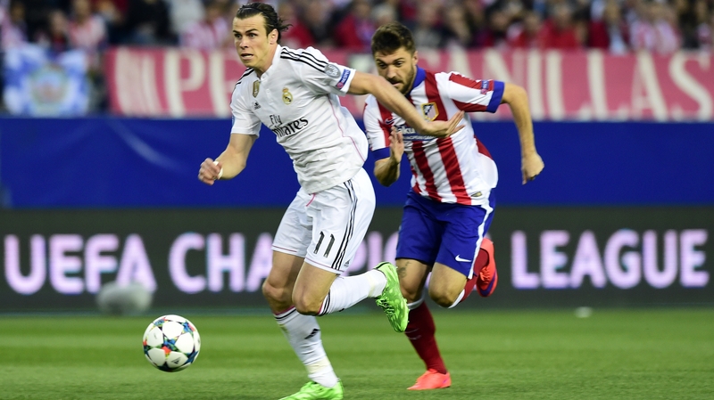 Real Madrid's Gareth Bale (L) vies with Atletico Madrid's Guilherme Siqueira in last week's first-leg clash