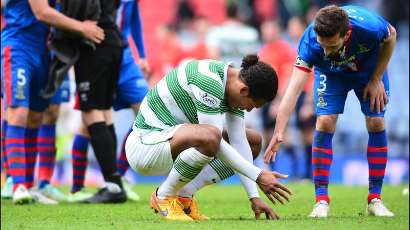 Celtic's Virgil van Dijk is consoled by Graeme Shinnie of Inverness Caledonian Thistle at the end of a thrilling Scottish Cup semi-final