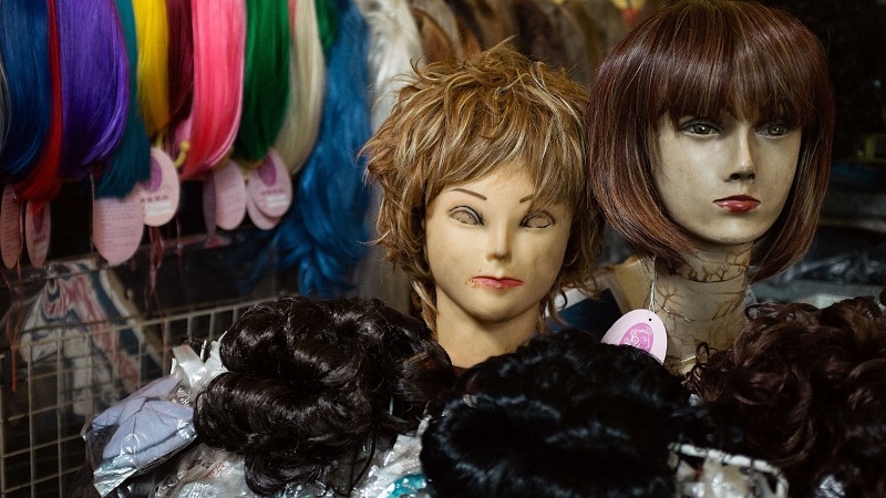 Wigs on display in the central market in Phnom Penh, Cambodia
