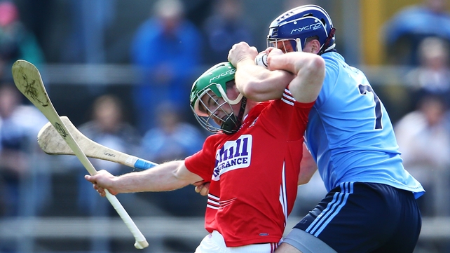 Dublin's Conal Keaney tackles Daniel Kearney of Cork during the AHL semi-final on Sunday
