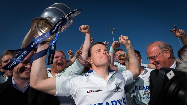 Cork Con's Gerry Hurley lifts The Bateman Cup after his side beat Clontarf on Saturday