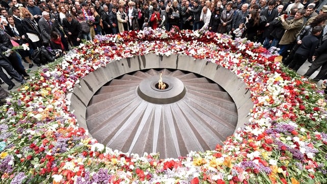 People lay flowers at the Tsitsernakaberd Memorial in Yerevan