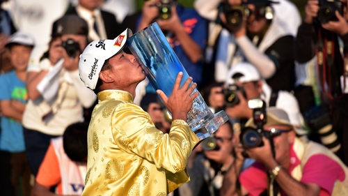 Wu Ashun poses with the trophy in Shanghai
