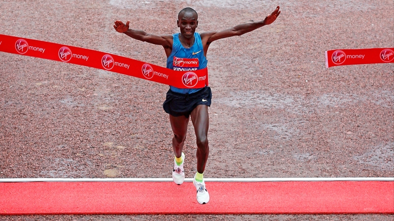 Eliud Kipchoge breaks the tape at 2:04.42