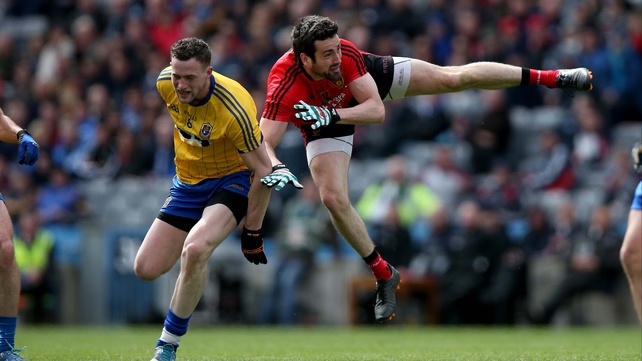 Roscommon's Kevin Higgins battles with Kevin McKernan of Down in the Allianz Football League Division 2 final; Roscommon went on to take the title