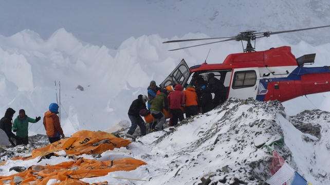Injured climbers are removed from Base Camp on Mount Everest. 17 people died in an avalanche triggered by the quake
