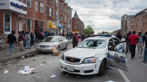 The riots broke out just a few blocks from the site of the funeral