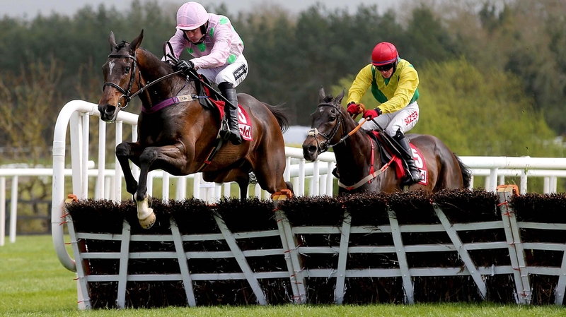 Douvan ridden by Ruby Walsh clears the last fence on the way to winning the Herald Champion Novice Hurdle