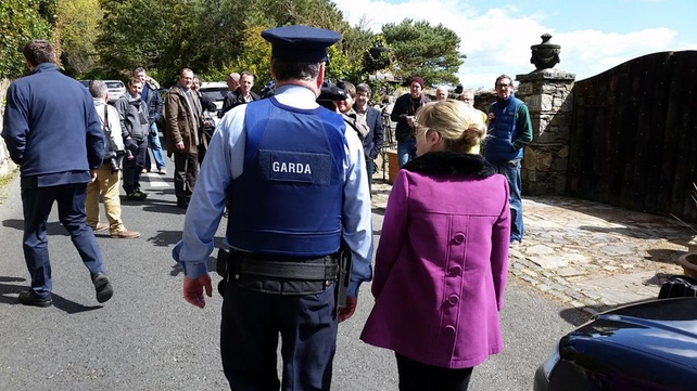 Gardaí arrive at the scene where assembled media and New Land League members are still gathered