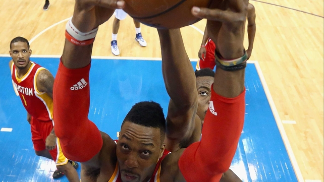 Dwight Howard of the Houston Rockets grabs a rebound against Al-Farouq Aminu of the Dallas Mavericks during game four of the Western Conference quarter-finals of the 2015 NBA play-offs at American Airlines Center