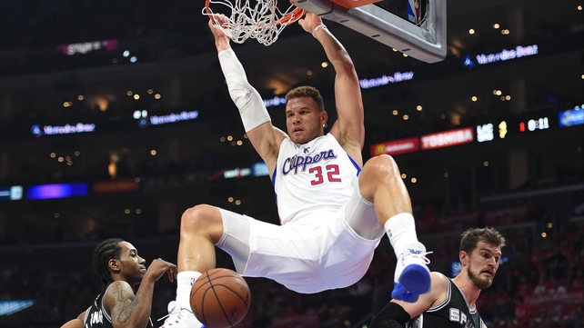 Blake Griffin of the Los Angeles Clippers dunks between Kawhi Leonard and Tiago Splitter of the San Antonio Spurs during game two of the Western Conference quarter-finals of the 2015 NBA play-offs at the Staples Center