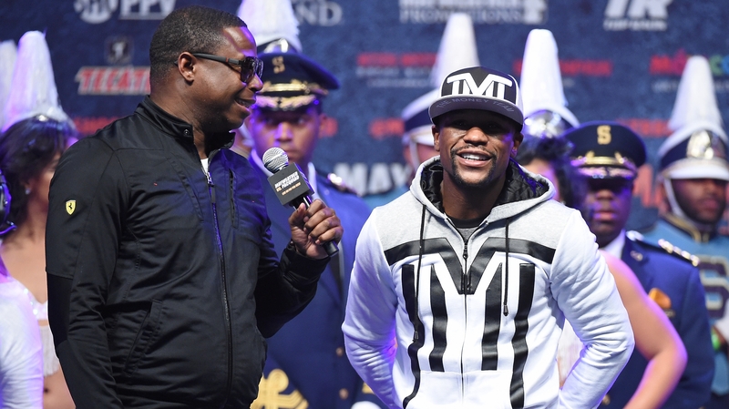Floyd Mayweather Jr (right) being interviewed at the MGM Grand Garden Arena