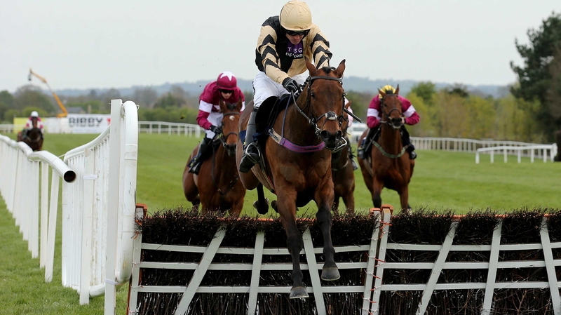 Nichols Canyon ridden by Ruby Walsh clears the last fence on his way to winning
