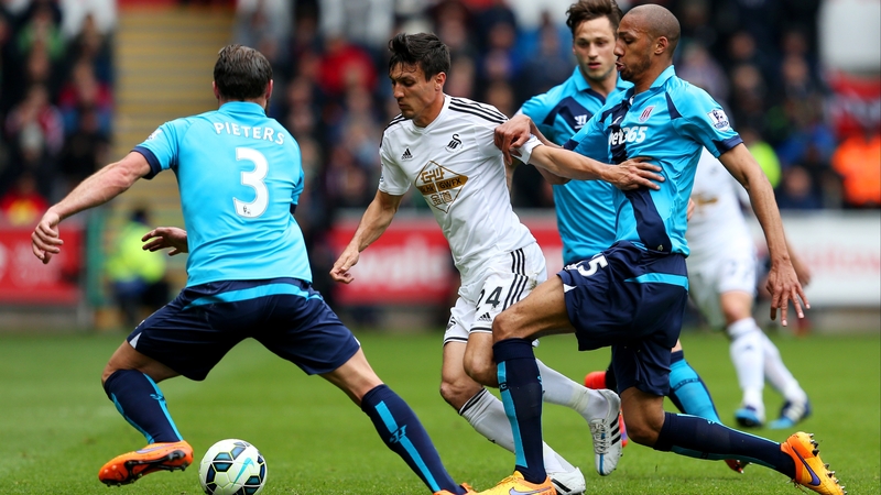 Jack Butland is outnumbered by Stoke defenders