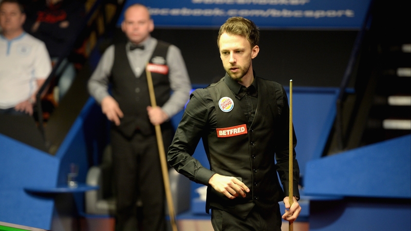 Judd Trump in action as Stuart Bingham watches on