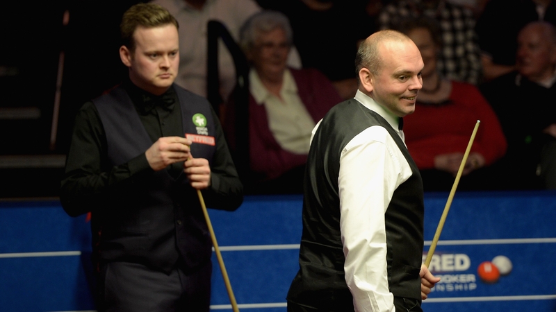 Stuart Bingham laughs as Shaun Murphy watches on earlier today