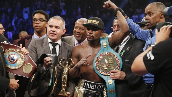Floyd Mayweather with his WBA and WBC welterweight belts