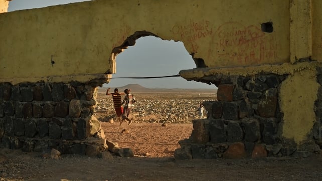 Boys play football in the Balbala area of Djibouti