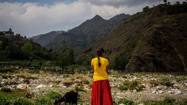 A woman surveys destruction in Nepal following an earthquake on 25 April