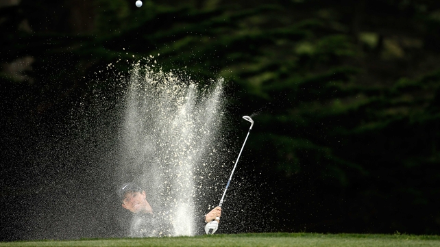 Tournament winner Rory McIlroy escapes from the bunker on the 18th hole during round three of the World Golf Championships-Cadillac Match Play at TPC Harding Park in San Francisco