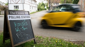 A sign for the Crown pub in South Moreton which is a temporary polling station
