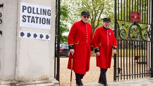 Chelsea pensioners leave after voting at a polling station in Chelsea, west London