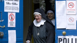 Nuns leave a polling station after voting in London