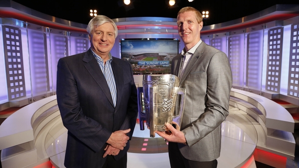 Michael Lyster and new Sunday Game analyst Henry Shefflin with the Liam MacCarthy Cup