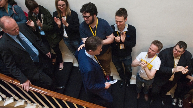 Liberal Democrat workers applaud Nick Clegg after he announced his resignation