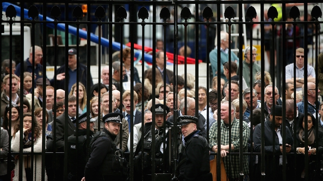 People wait outside Downing Street for a glimpse of the Prime Minister