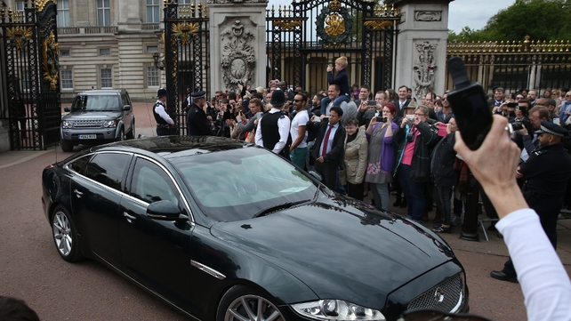 The Camerons leave Buckingham Palace following an audience with the Queen