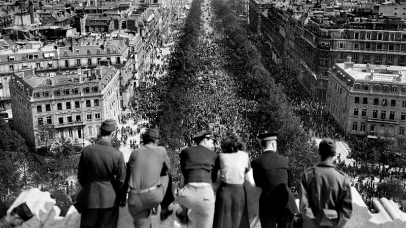 People gather in Paris to celebrate the end of the war in 1945