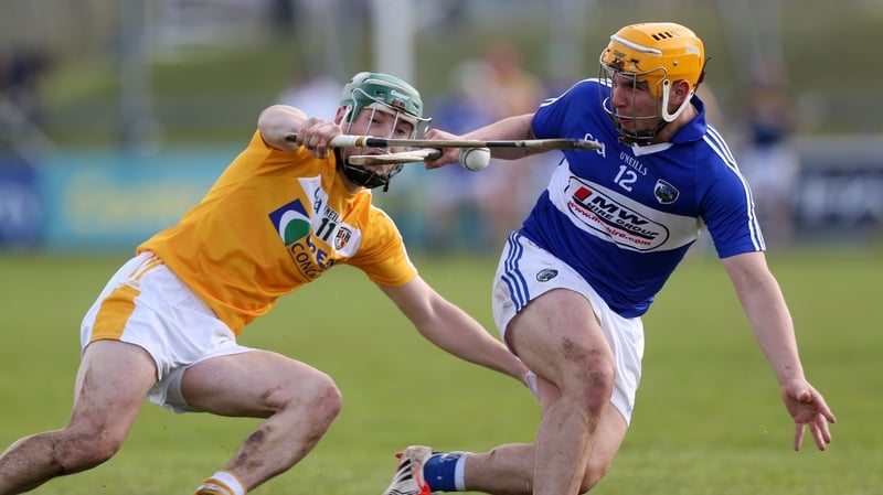 Laois's Charles Dwyer in action against Antrim's Paul Shiels