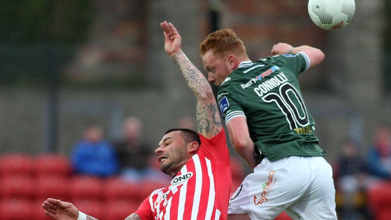 Derry's Anthony Elding and Galway's Ryan Connolly clash in the air