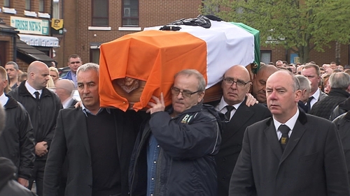 Hundreds of people lined the streets as the coffin was brought from the family home