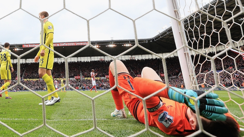 Hugo Lloris of Tottenham Hotspur lies in the goal after the goal scored by Charlie Adam
