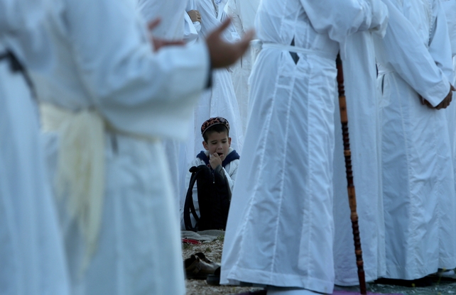 A child sits amid Samaritan worshippers Mount Gerizim near Nablus