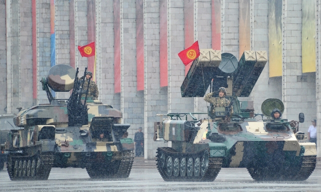 Kyrgyz military vehicles ride through Ala-Too Square during the Victory Day military parade in Bishkek